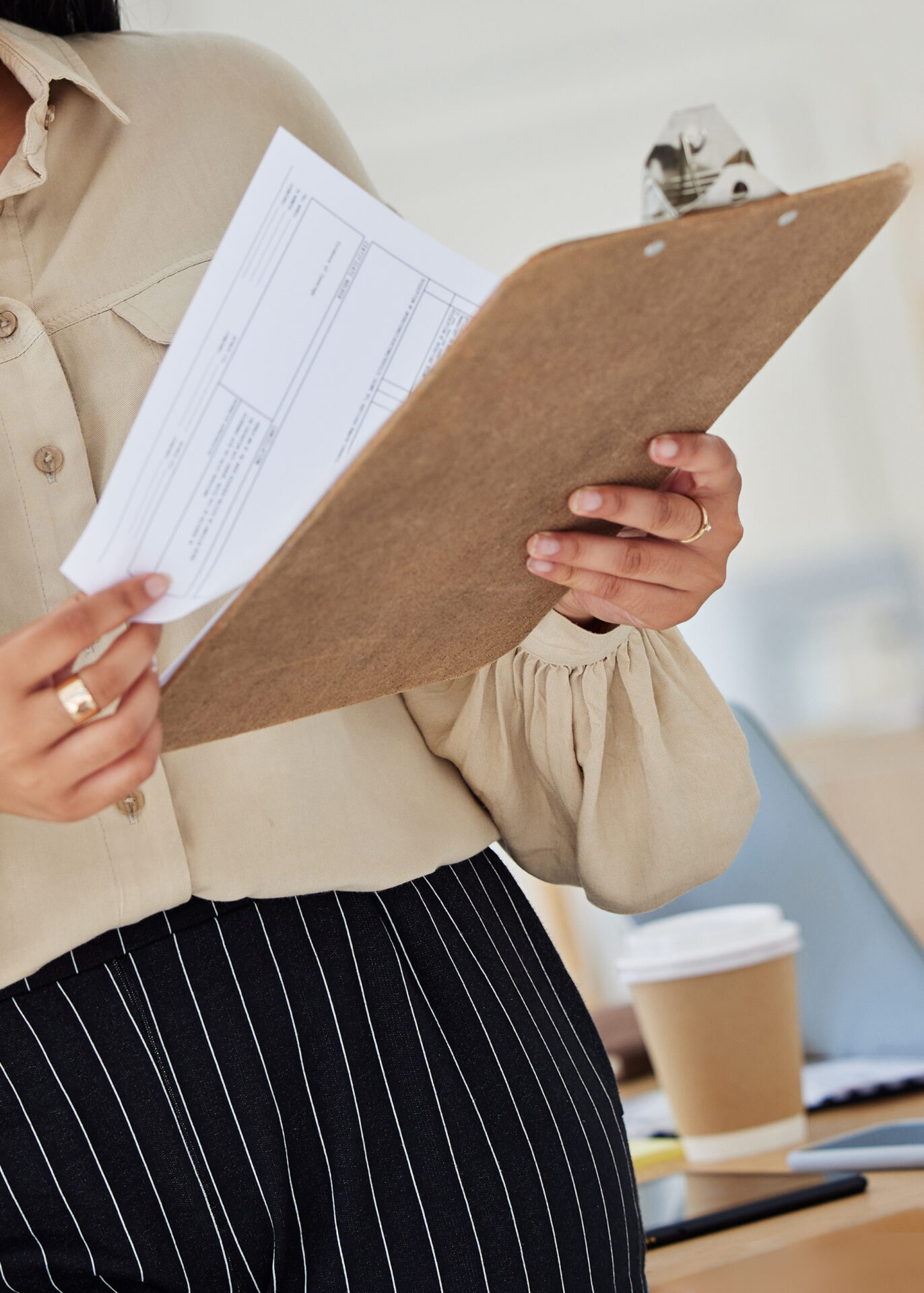 Review Contract And Report With A Business Woman Holding A Clipboard With Paperwork